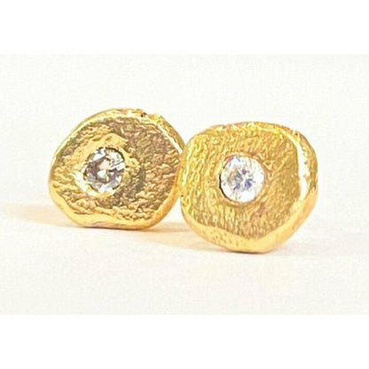 Add a touch of elegance and sophistication to your look with these stunning textured diamond stud earrings. The intricate textured design adds a unique twist to the classic diamond studs, creating a sparkling and glamorous accessory that will elevate any outfit.  1.8 mm pointer diamond flush set.  6mm-6.25  not a regular shape textured.  small butterfly back.