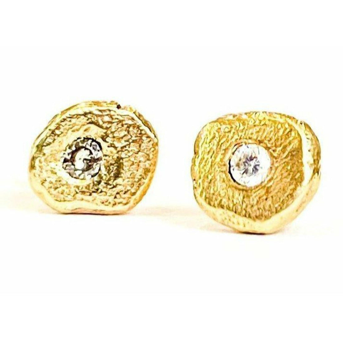 Add a touch of elegance and sophistication to your look with these stunning textured diamond stud earrings. The intricate textured design adds a unique twist to the classic diamond studs, creating a sparkling and glamorous accessory that will elevate any outfit.  1.8 mm pointer diamond flush set.  6mm-6.25  not a regular shape textured.  small butterfly back.