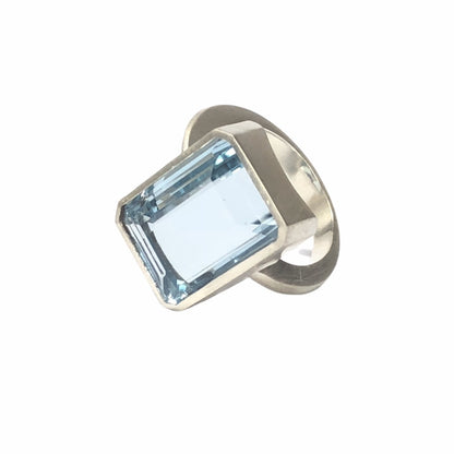 Add a touch of elegance to any outfit with this stunning Bright Blue Topaz Cocktail Ring. The vibrant blue color of the topaz stone is sure to catch everyone's eye, and the elegant cocktail design adds a sophisticated touch. Treat yourself or someone special to this eye-catching ring today!  16mm x 12mm Blue Topaz.