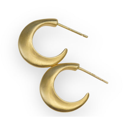 Step up your earring game with our Small Half Moon Hoops. With their versatile design, these hoops are perfect for any occasion. Easy to wear and a classic style. 14k Yellow Gold Satin Finish HxW: 14.04mm x 3.37mm